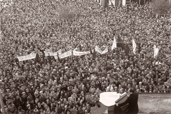 Menachem Begin addresses a crowd in Tel Aviv at a protest rally against accepting German Reparations